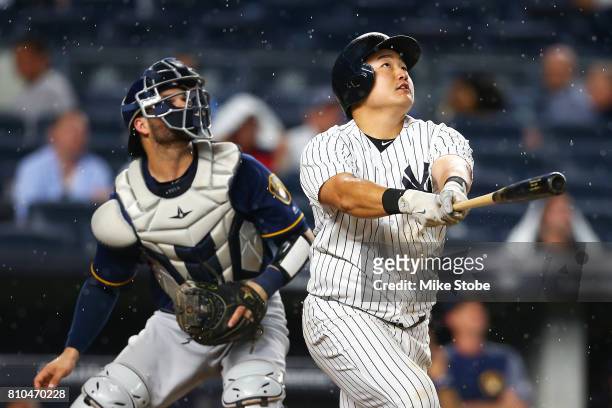 Ji-Man Choi of the New York Yankees connects on a 2-run home run in the fourth inning against the Milwaukee Brewers at Yankee Stadium on July 7, 2017...