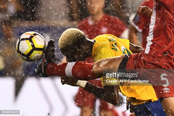 French Guiana's forward Arnold Abelinti and Canada's defender Dejan Jakovic vie for the ball during their 2017 Concacaf Gold Cup Group A match at the...