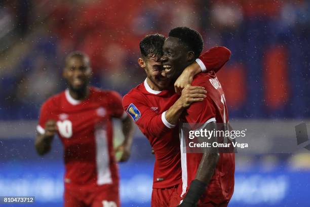 Alphonso Davies of Canada celebrates with teammates after scoring the fourth goal of his team during the Group A match between French Guiana and...