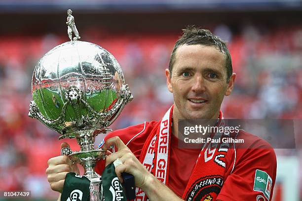 Paul McCarthy the Ebbsfleet captain poses with the trophy during the FA Trophy Final between Ebbsfleet United and Torquay United at Wembley Stadium...