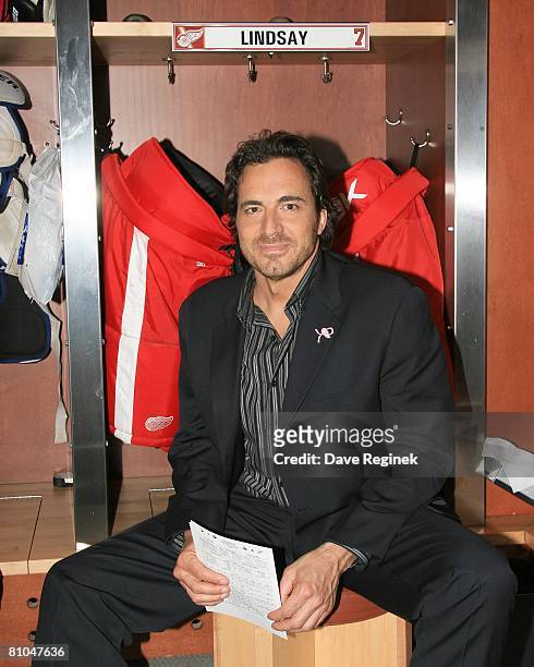 Actor Thorsten Kaye of ABC daytime drama, All My Children, poses for a photo in front of the NHL Hall of Fame locker Ted Lindsey during his tour of...