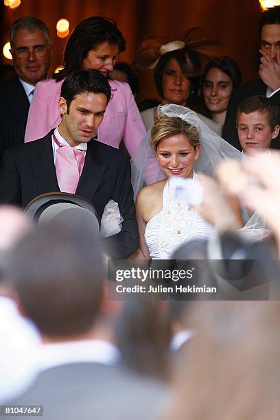 Gurvan Rallon , Jeanne-Marie Martin and her mother Cecilia Attias leave St Pierre de Neuilly church on May 10, 2008 in Paris, France.