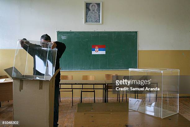 Serbian man prepares a polling station at a school in northern Mitrovica on May 10, 2008 in Mitrovica, Kosovo. Parliamentary and local elections are...