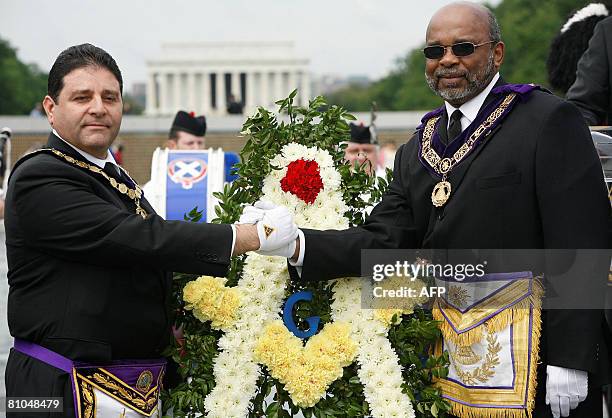 Akram Elias, Grand Master, Grand Lodge of Washington DC, shakes hand with Harden M. Keys, Grand Master, Prince Hall Grand Lodge of Washington DC,...