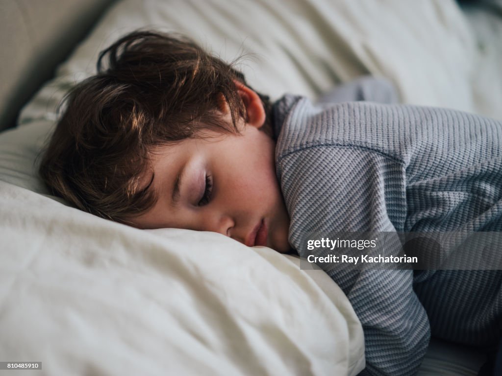 Toddler sleeping on pillow