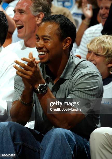 Tiger Woods, professional golfer, watches the Orlando Magic during Game Four of the Eastern Conference Semifinals against the Detroit Pistons during...