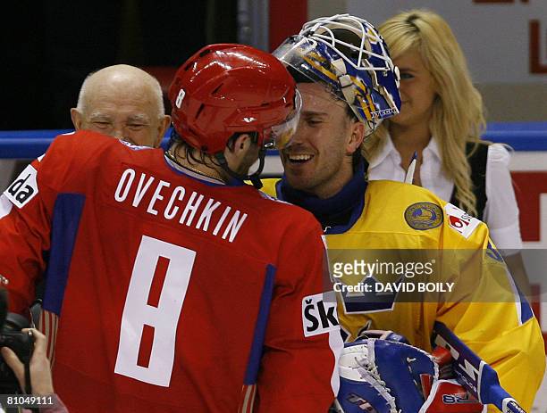 Players of the game, Alexander Ovechkin of Russia and Henrik Lundqvist of Sweden shake hands after Russia's victory over Sweden during the...