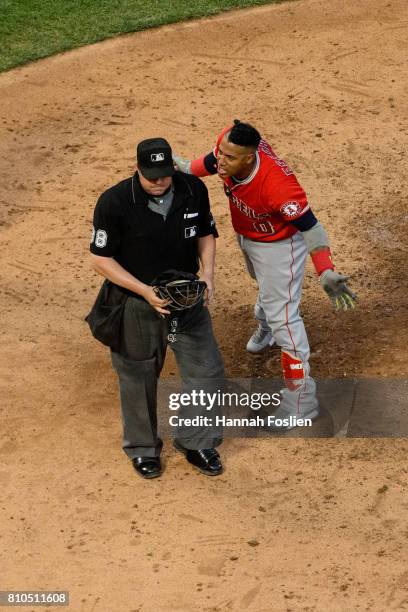 Yunel Escobar of the Los Angeles Angels of Anaheim reacts after home plate umpire Doug Eddings ejected him from the game against the Minnesota Twins...