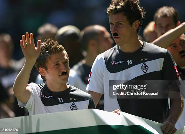 Marko Marin and Rob DFriend of Gladbach celebrate the climb to the Bundesliga with beards before the Second Bundesliga match between Borussia...