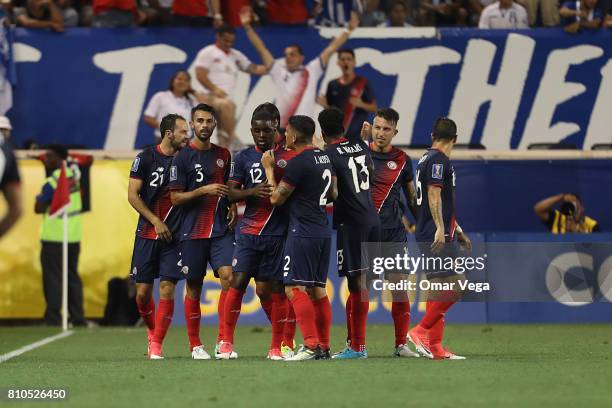 Marco Ureña of Costa Rica celebrates with teammates after scoring the first goal of his team during the Group A match between Honduras and Costa Rica...