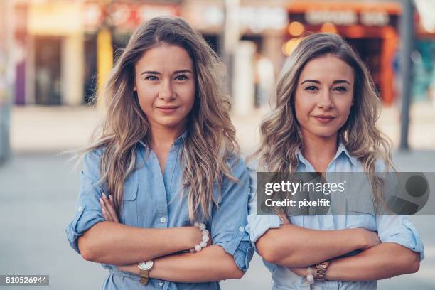 sassy sisters - sibling jealousy stock pictures, royalty-free photos & images