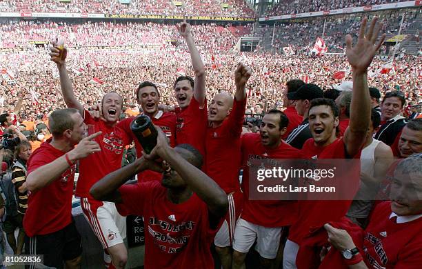 Players of Koeln celebrate after winning the Second Bundesliga match between 1. FC Koeln and FSV Mainz 05 at the RheinEnergie stadium on May 11, 2008...