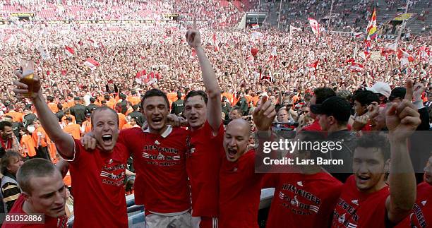 Players of Koeln celebrate after winning the Second Bundesliga match between 1. FC Koeln and FSV Mainz 05 at the RheinEnergie stadium on May 11, 2008...