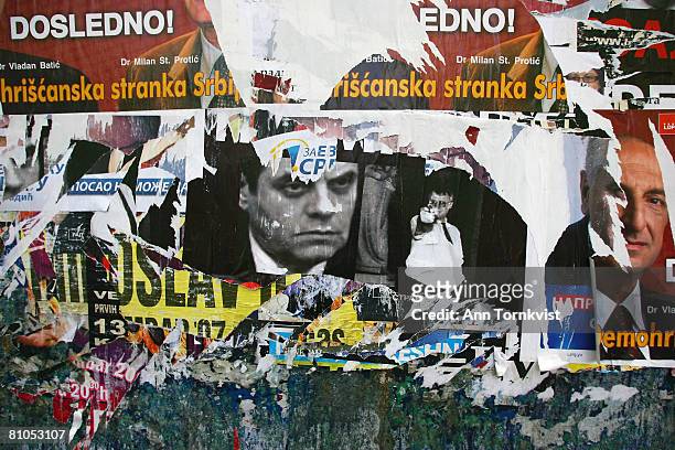 An image of Serbia's nationalist Prime Minister Vojislav Kostunica is prominent among the ripped election posters covering a wall on May 11, 2008 in...