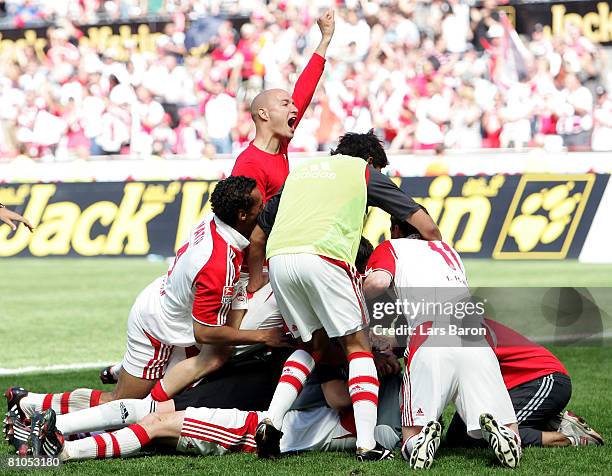 Players of Koeln celebrate after winning the Second Bundesliga match between 1. FC Koeln and FSV Mainz 05 at the RheinEnergie stadium on May 11, 2008...