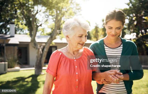 i've got you, mom - adult offspring stock pictures, royalty-free photos & images