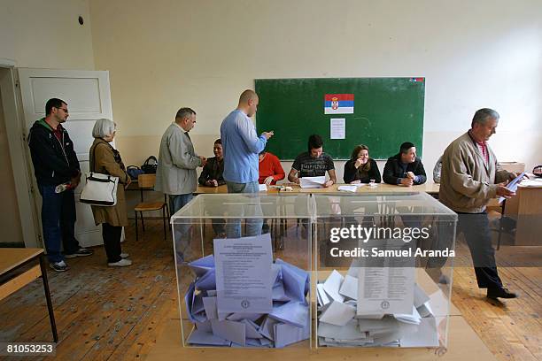 Line of Serbians wait to cast their votes in a polling station inside a school May 11, 2008 in Mitrovica, in northern Kosovo. Serbs voted in...