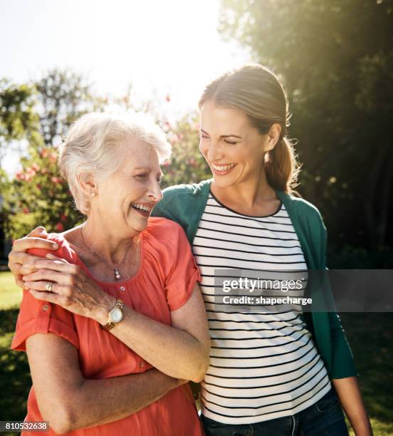 that mother daughter bond...the gift that keeps on giving - mature woman daughter stock pictures, royalty-free photos & images