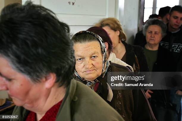 Serbian woman waits in a line to cast her vote in a polling station inside a school May 11, 2008 in Mitrovica, in northern Kosovo. Serbs voted in...