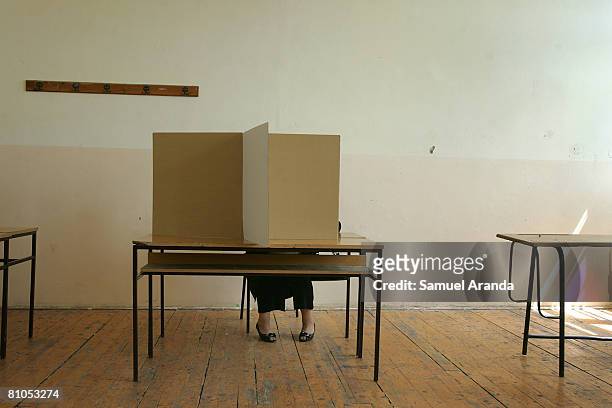Serbian woman prepares to cast her vote in a polling station inside a school May 11, 2008 in Mitrovica, in northern Kosovo. Serbs voted in...