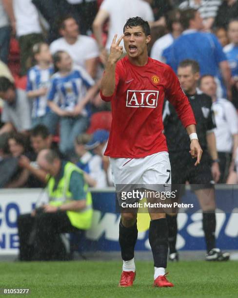 Cristiano Ronaldo of Manchester United celebrates scoring their first goal from the penalty spot during the Barclays FA Premier League match between...