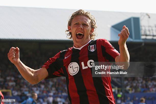 Jimmy Bullard celebrates after teammate, Danny Murphy scores the scoring the opening goal during the Barclays Premier League match between Portsmouth...