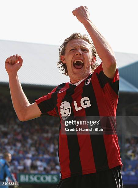 Jimmy Bullard celebrates after teammate, Danny Murphy scores the scoring the opening goal during the Barclays Premier League match between Portsmouth...