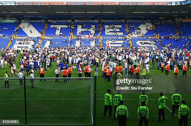 Birmingham City fans invade the pitch after their team was relegated during the Barclays Premier League match between Birmingham City and Blackburn...