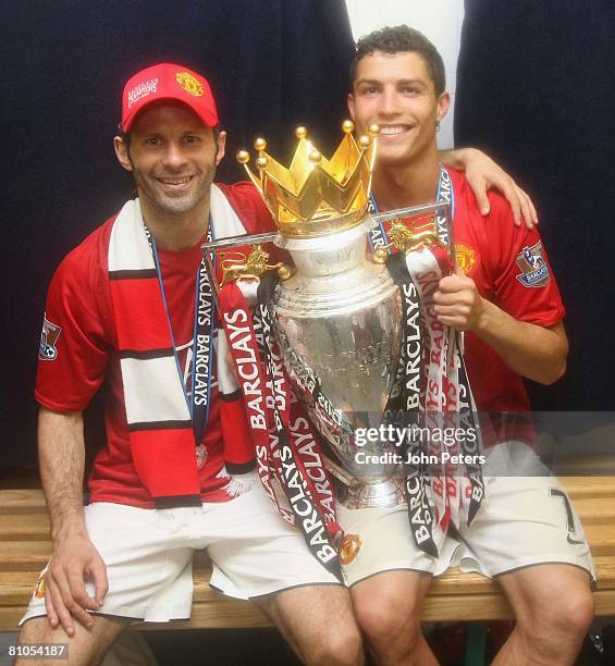 Ryan Giggs and Cristiano Ronaldo of Manchester United celebrate with the Premier League trophy in the dressing room afetr the Barclays FA Premier...