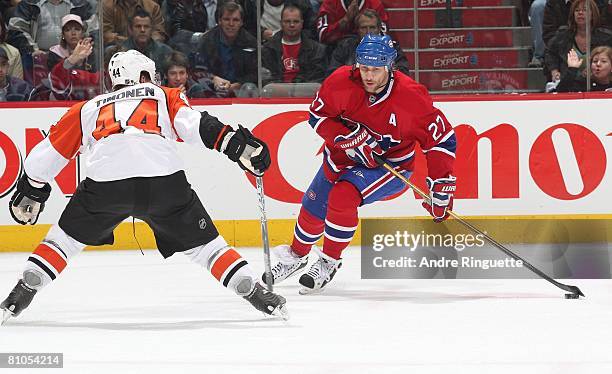 Alexei Kovalev of the Montreal Canadiens stickhandles the puck against Kimmo Timonen of the Philadelphia Flyers during game five of the Eastern...