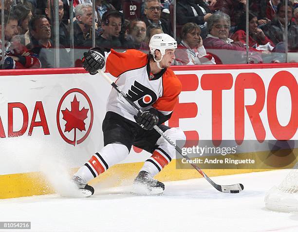 Randy Jones of the Philadelphia Flyers stickhandles the puck against the Montreal Canadiens during game five of the Eastern Conference Semifinals of...