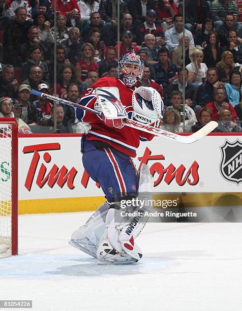 Carey Price of the Montreal Canadiens looks up for a deflected puck against the Philadelphia Flyers during game five of the Eastern Conference...