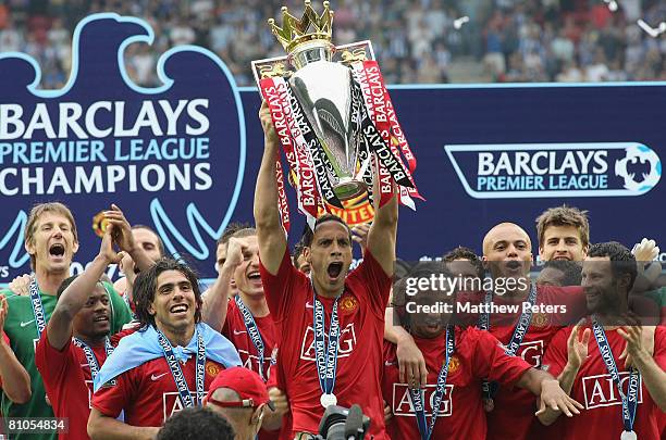 Rio Ferdinand of Manchester United squad lifts the Premiership trophy after the Barclays FA Premier League match between Wigan Athletic and...