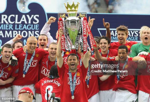 Ryan Giggs of Manchester United squad lifts the Premiership trophy after the Barclays FA Premier League match between Wigan Athletic and Manchester...