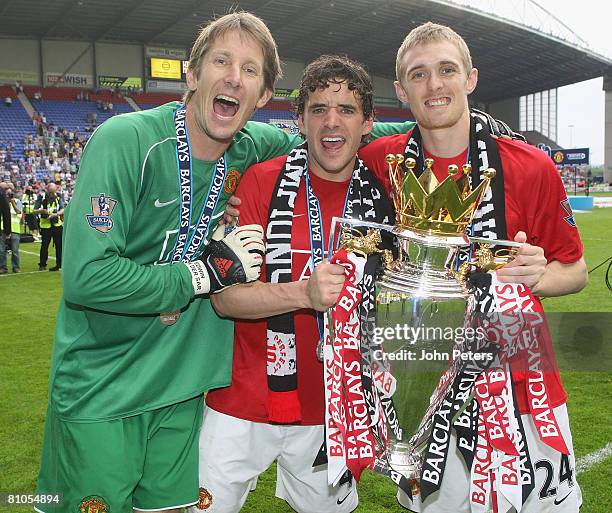 Edwin van der Sar, Owen Hargreaves and Darren Fletcher of Manchester United celebrates with the Premier League trophy on the pitch after the Barclays...