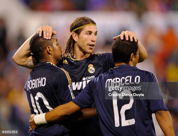 Robinho of Real Madrid is congratulated by Sergio Ramos and Marcelo after he scored Real's second goal during the La Liga match between Real Zaragoza...