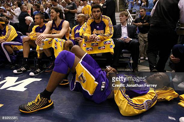 Kobe Bryant of the Los Angeles Lakers lays on the floor with an injured back against the Utah Jazz in Game Four of the Western Conference Semifinals...