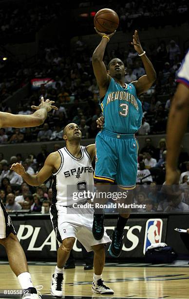 Guard Chris Paul of the New Orleans Hornets takes a shot against Tony Parker of the San Antonio Spurs in Game Four of the Western Conference...