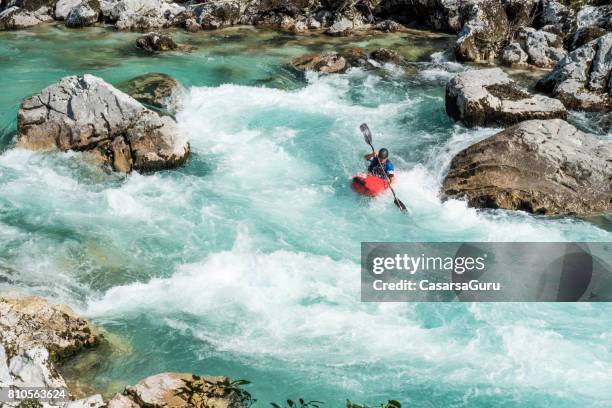 mature man kayaking in white water of river soca - kayaking rapids stock pictures, royalty-free photos & images