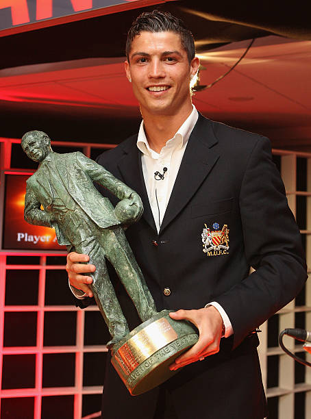 Cristiano Ronaldo of Manchester United poses with his Sir Matt Busby Fans' Player of the Year award during the annual Manchester United Player of the...