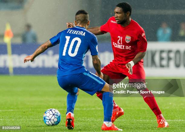 Jiangsu FC forward Alex Teixeira fights for the ball with Becamex Binh Duong forward Christian Jose Nsi Amougou during the AFC Champions League 2016...
