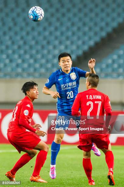Becamex Binh Duong midfielder Nguyen Trong Huy, Jiangsu FC midfielder Zhang Xinlin, and Becamex Binh Duong midfielder Trinh Quang Vinh compete for...