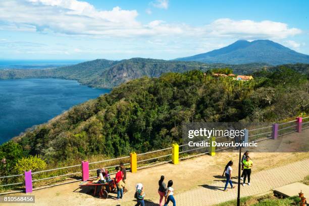 tourists at viewpoint from laguna apoyo, nicaragua. - apoyo imagens e fotografias de stock
