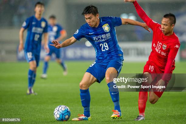 Jiangsu FC midfielder Yang Jiawei fights for the ball with Becamex Binh Duong midfielder Nguyen Xuan Thanh during the AFC Champions League 2016 -...
