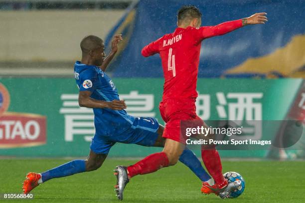 Jiangsu FC midfielder Ramires Santos fights for the ball with Becamex Binh Duong defender Michal during the AFC Champions League 2016 - Group Stage -...