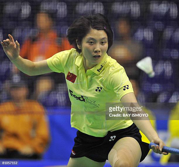 Jiang Yanjiao of China returns a shot against Carola Bott of Germany during their Thomas Cup badminton match in Jakarta on May 12, 2008. Jiang won...