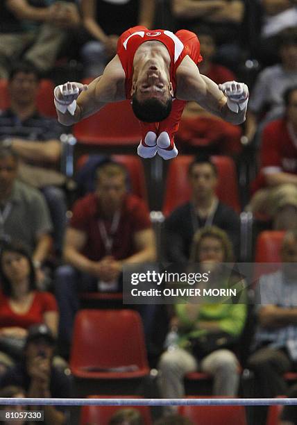 Turkey's Umit Samiloglu competes on horizontal bar during the 28th European Men's Artistic Gymnastics Championships on May 11, 2008 at Malley sports...