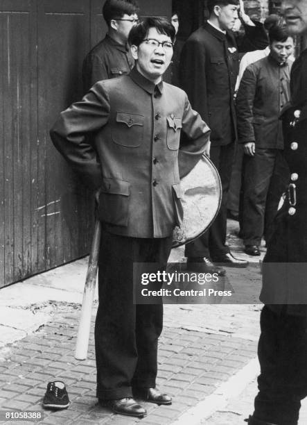 Member of the Chinese legation in London, armed with a baseball bat and a dustbin lid, during a violent dispute over the presence of a Special Branch...