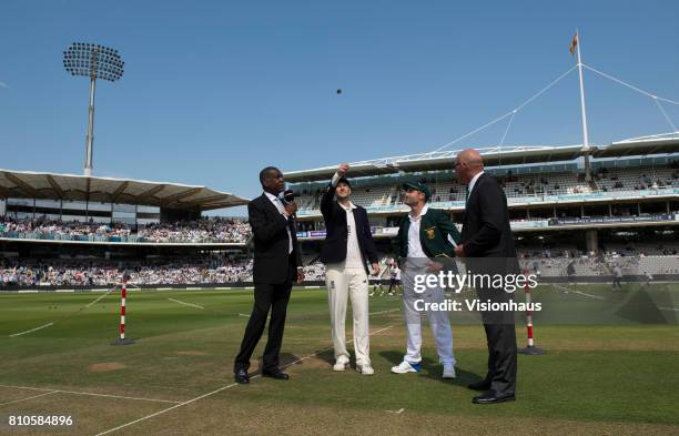 England Captain Joe Root performs the coin toss watched by Michael Holding of Sky Sports, South Africa Captain Dean Elgar and Match Referee Jeff...