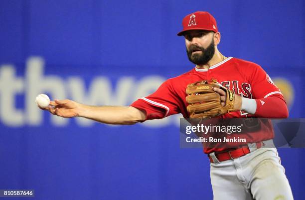 Danny Espinosa of the Los Angeles Angels of Anaheim throws out Nomar Mazara of the Texas Rangers during the eighth inning at Globe Life Park in...